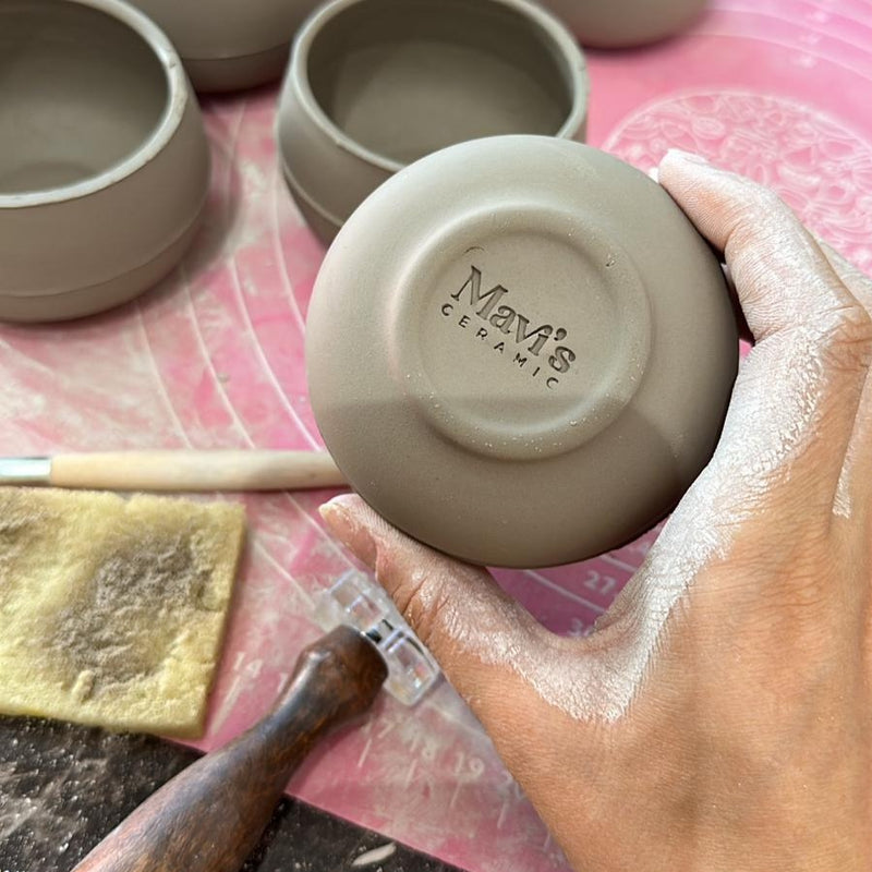 How to use personalized stamp tools for marking pottery.